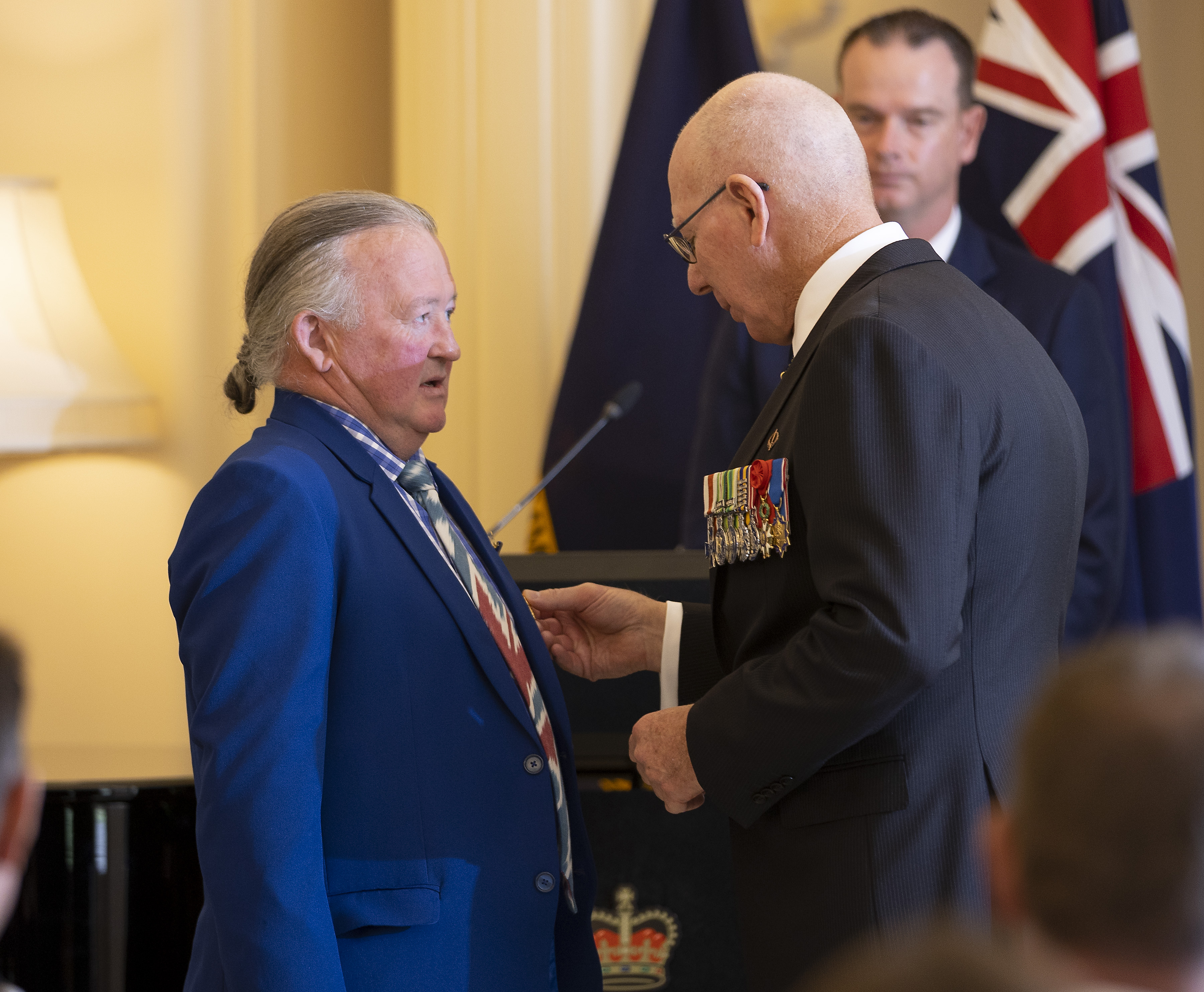 Mr Peter Crisp OAM receives the insignia of his award from the Governor-General