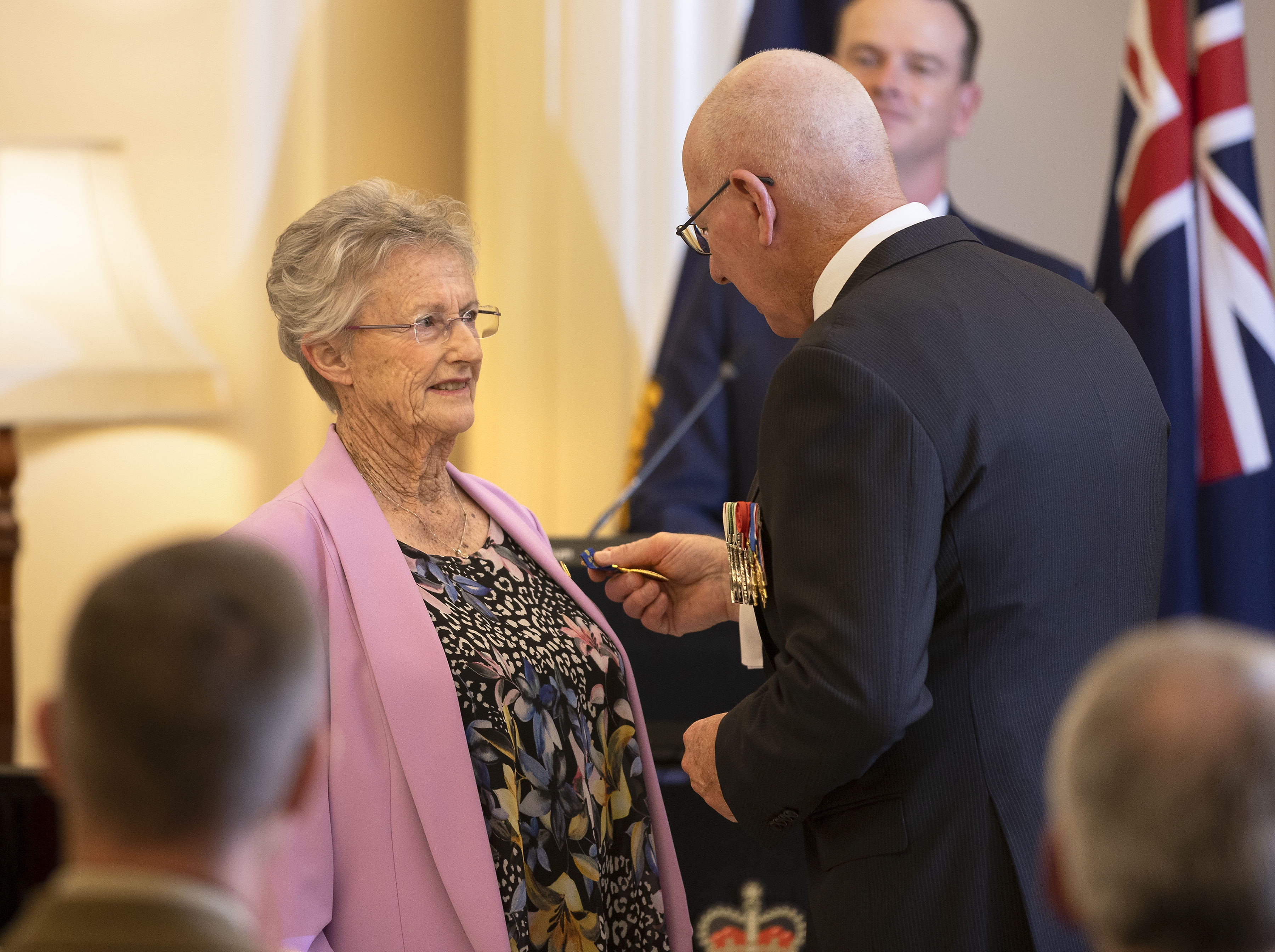 Ms Coralie Amos OAM receives the insignia of her award from the Governor-General