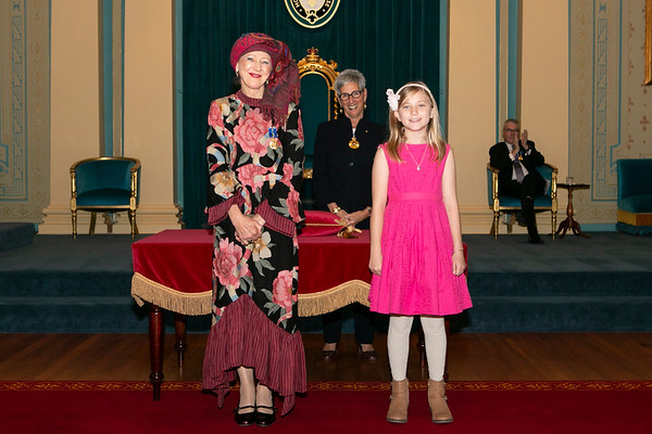 Kathryn MacKenzie OAM receiving the insignia of her award from the Victorian Governor