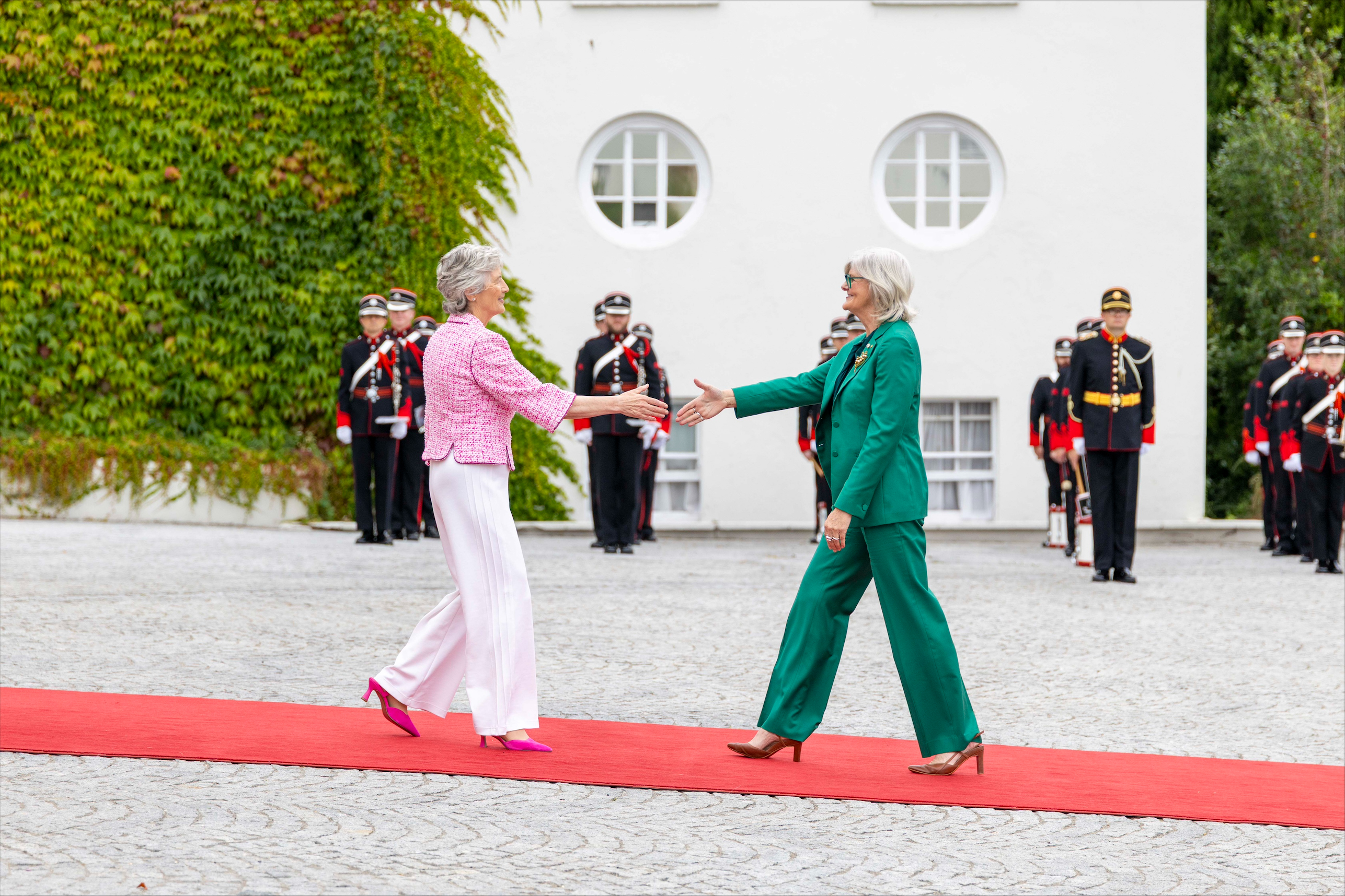 Governor-General extends her hand to meet President Connolly