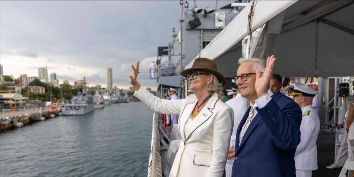 Their Excellencies waving to a crowd