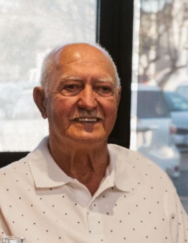 Costa Angelkov OAM smiling at camera