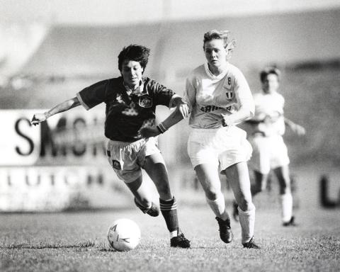 Moya Dodd AO playing football