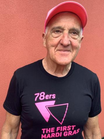 William Sergeant OAM smiling wearing pink cap