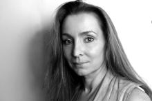 A black and white photo of a woman with long hair